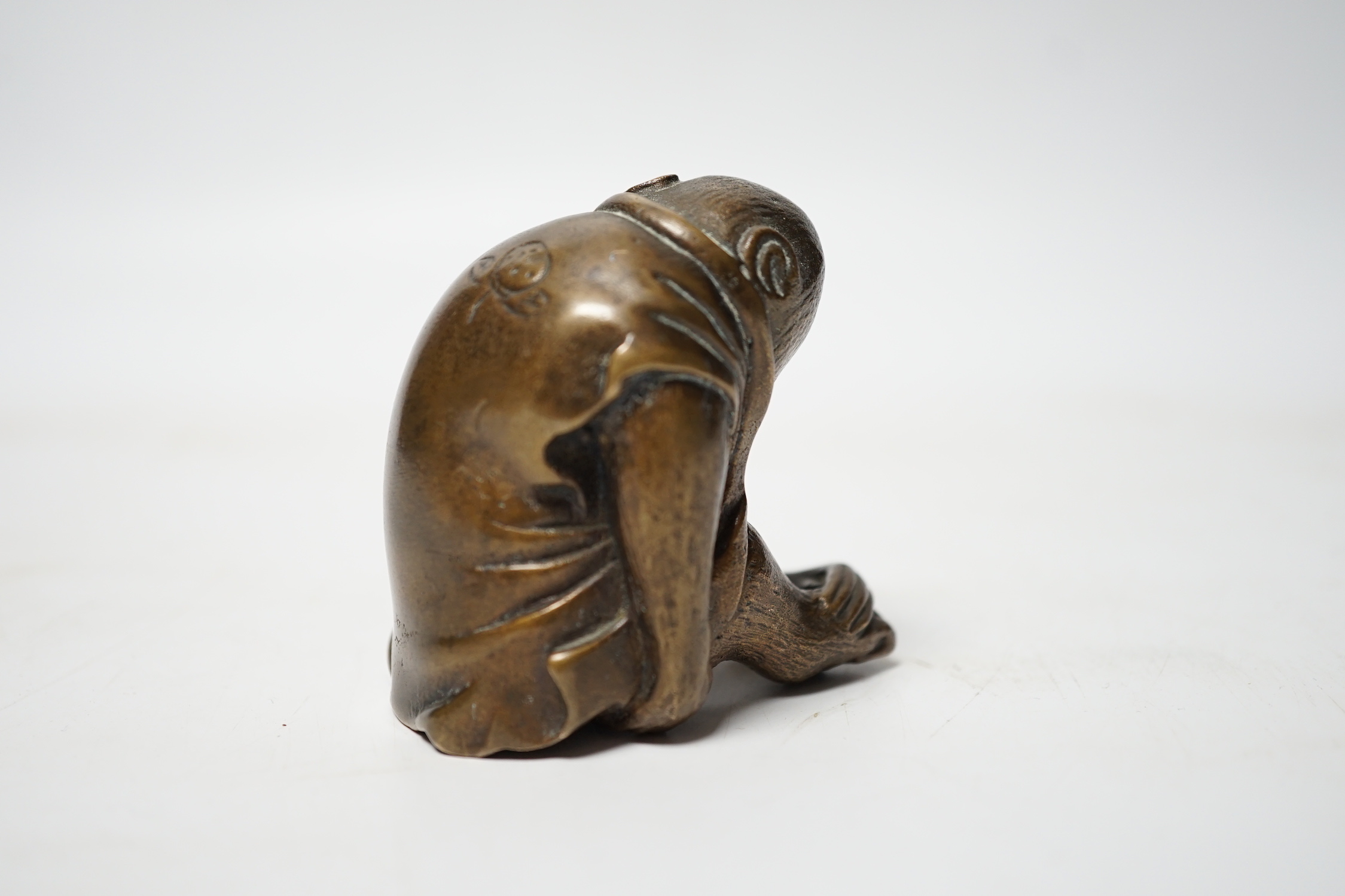 A Japanese bronze model of a monkey, 19th century, 5.5cm high